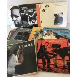 A box of vintage piano jazz and Boogie Woogie vinyl records.