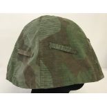 WWII pattern German helmet cover made from a Zeltbahn Poncho.