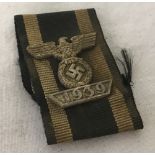 WWII pattern German spange on a piece of 2nd class ribbon.