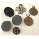 7 assorted WWII pattern German medals and badges.