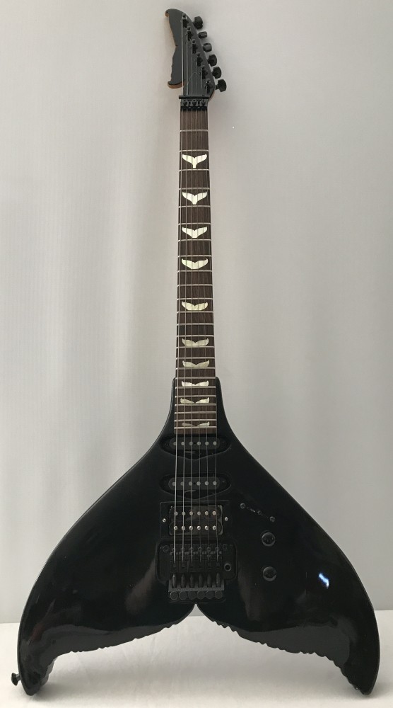 A unusual whale tail electric guitar.