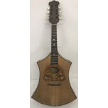 A vintage German unusual shaped mandolin with mother of pearl detailed inlay.