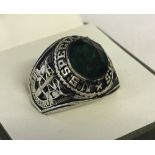 Reproduction Vietnam era US Special Forces ring set with green stone.