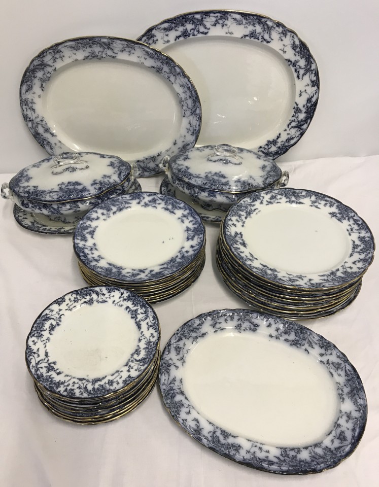 Antique Wedgwood part dinner service with flo-blue design.