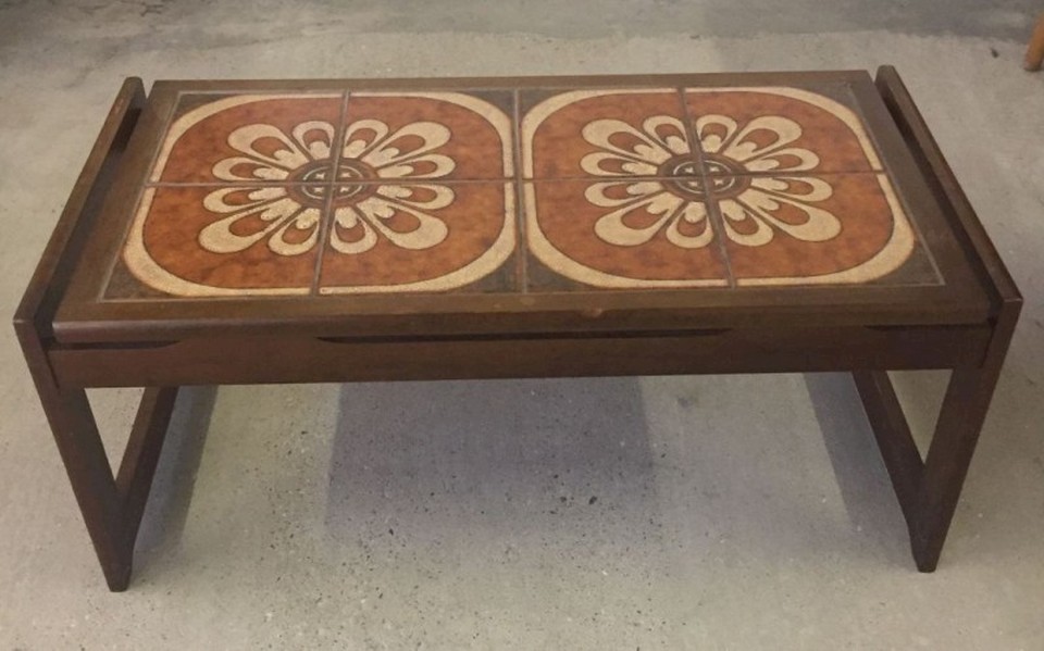 A c1970s brown tiled topped coffee table.