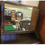 A vintage dark wood framed table top swing mirror.
