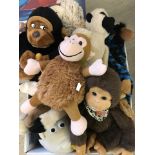 A box of assorted soft toy monkeys.