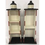 2 wooden lighthouse shaped shelving units.