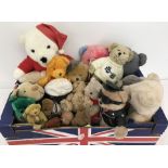 A box of assorted soft teddy bears.