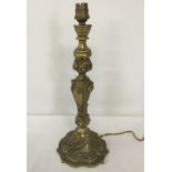 A vintage decorative brass table lamp base.