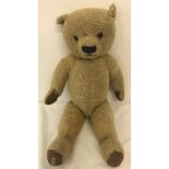 A 1950's Chad Valley jointed Teddy Bear with blond hair, glass eyes & padded paws.