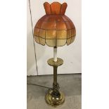 A vintage brass based table lamp.