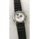 A Mickey Mouse smiling face wristwatch.