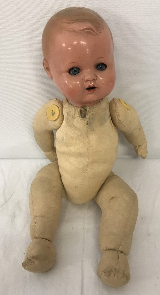 German bisque headed boy doll with soft body.
