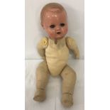 German bisque headed boy doll with soft body.