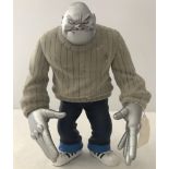 MimiMo collectors figurine with moveable hands and arms.