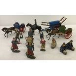 A collection of vintage lead farm figures & carts.