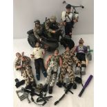 A box of assorted Action Man figures and accessories.