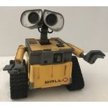 A Wall.E robot toy by Disney/Pixar Thinkway Toys.