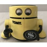 A yellow and black late 1980's "Mr. Money" automatic robot money bank by Tomy.
