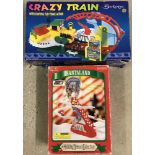A boxed Berketex Crazy Train playset together with A DY Toy Santa moving toy.