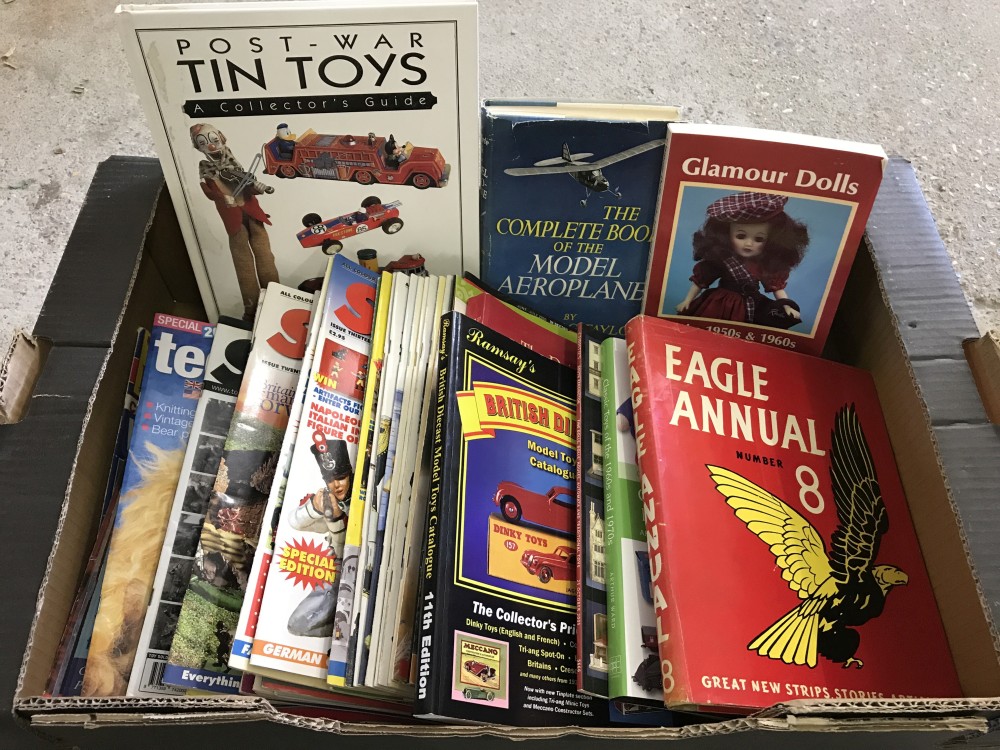 A box of Toy & doll reference books and magazines.