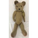 A 1930's straw filled, blonde haired, jointed Teddy bear possibly Pintel.