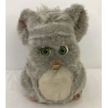 A 2005 Hasbro and Tiger Electronics grey interactive "Furby" toy.
