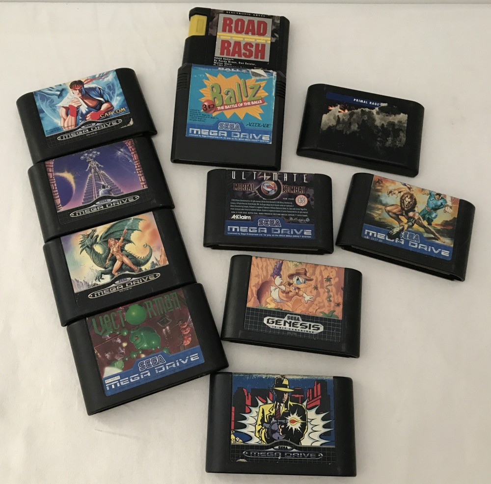 10 vintage Sega Mega Drive games cartridges together with a Sega Genesis game cartridge.