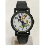 A Mickey Mouse wrist watch by Apollo showing Mickey Mouse playing football.