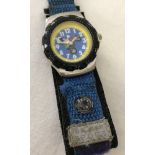 A Mickey Mouse wristwatch from the Sports range. Woven velcro strap with small compass.