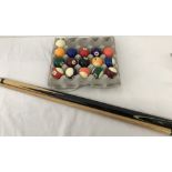 A set of American pool ball (stripes & spots) with cue ball and Riley pool cue.