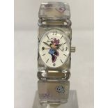 A ladies/girls wrist watch showing a dancing Minnie Mouse.