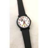 A Disney store exclusive wristwatch showing a classic stance Mickey mouse with moving hands.