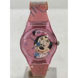 A Minnie Mouse girls wristwatch with pink plastic case and pink rubber strap,