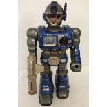 A 2002 Happy Kid Toy group Super Fighter robot in blue and grey.