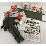 A vintage action man Medic outfit, accessories and leaflet.