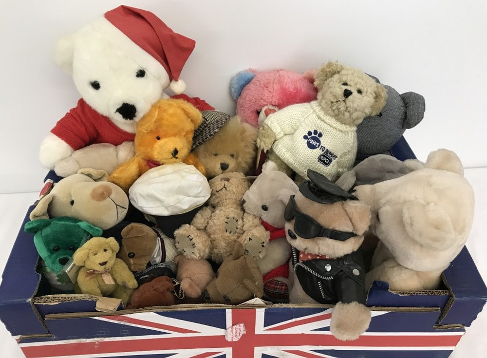 A box of assorted soft teddy bears.