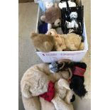 A box of assorted soft toys, mostly dogs and bears.