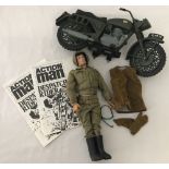 A vintage 1970's Action Man with dispatch rider outfit and accessories.
