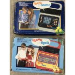 2 boxed Texas Instruments electronic teaching games.