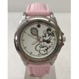 A Minnie Mouse playing tennis wrist watch with pale pink silicone strap.