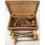 A vintage wooden table croquet set.