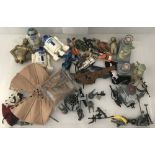 A collection of Star wars figures, guns, weapons and accessories.