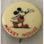 A vintage Mickey Mouse pin badge.