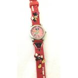 A red dial Mickey Mouse playing football wristwatch.