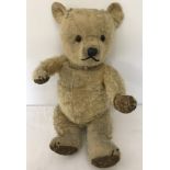 A vintage plush teddy bear.