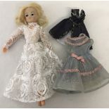 An original c1970's Sindy doll with 3 dresses.