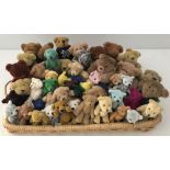 A tray of 50+ miniature jointed soft teddy bears.