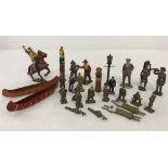 A collection of vintage lead toy soldiers & railway figures.